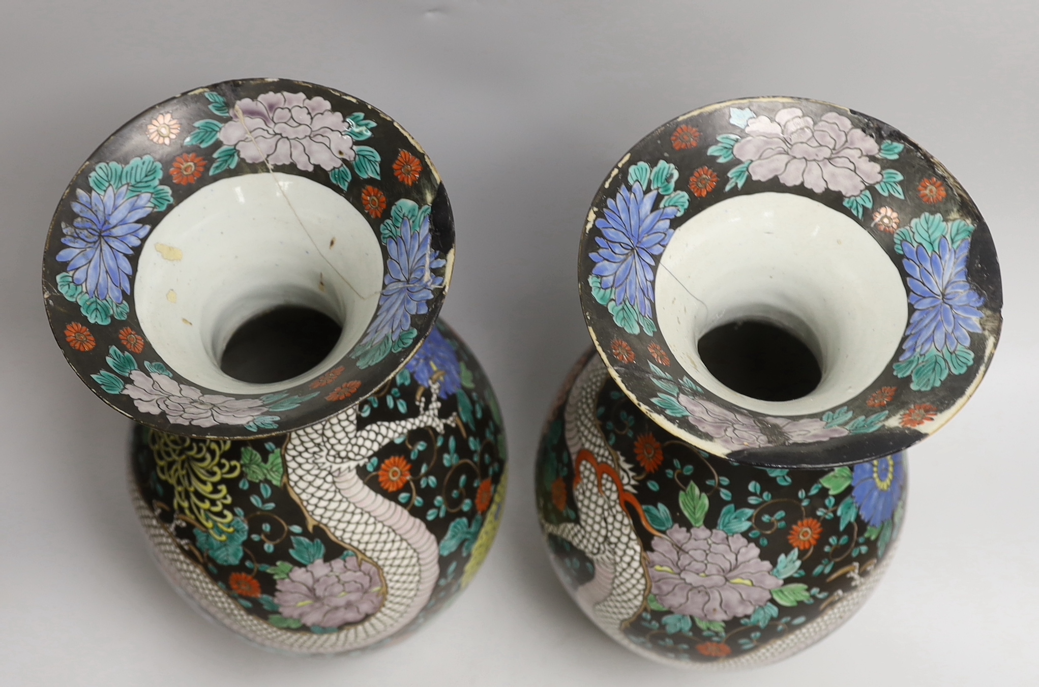 A pair of Japanese black ground ‘dragon’ vases, 37cm